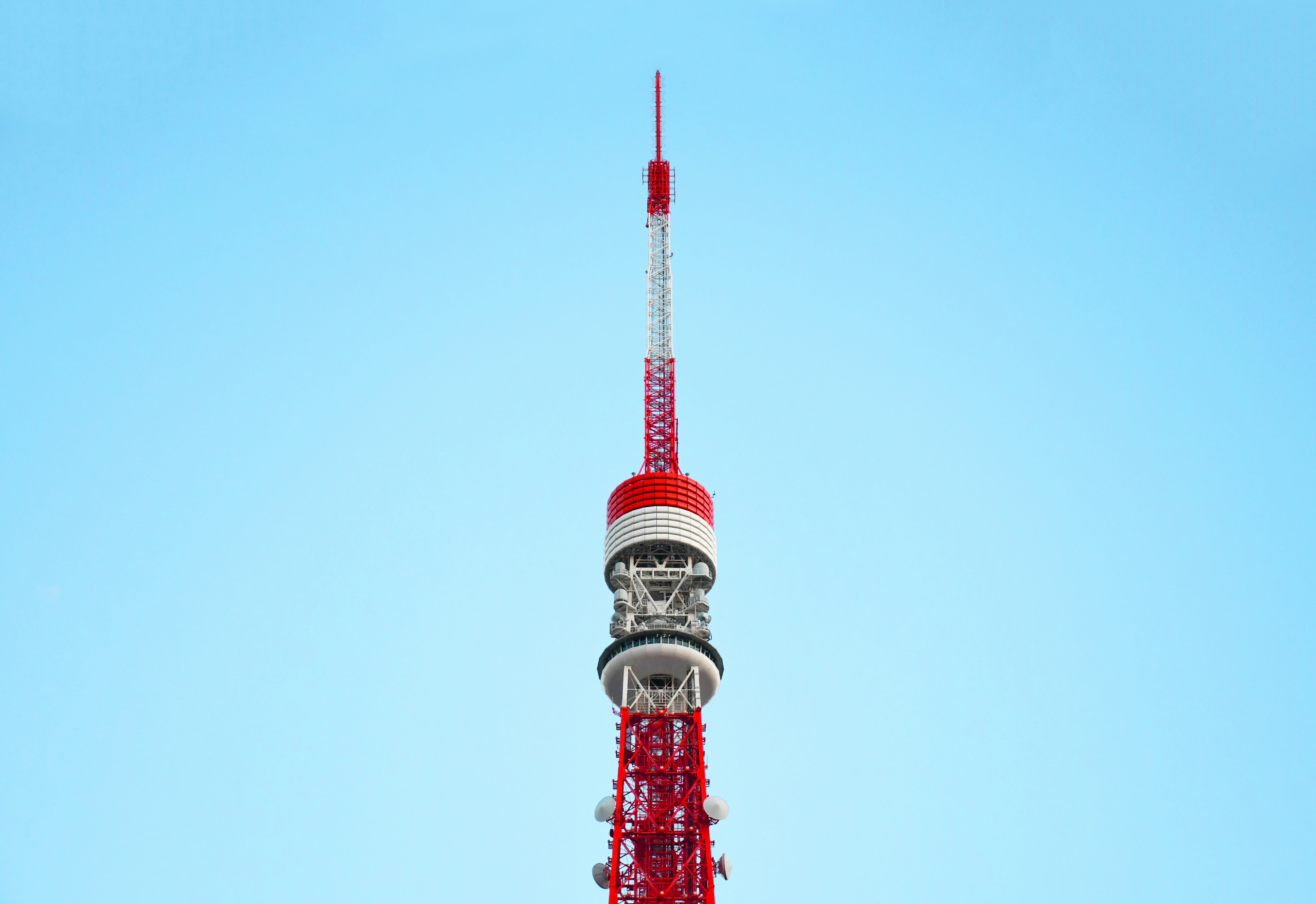 red and white tower under blue sky