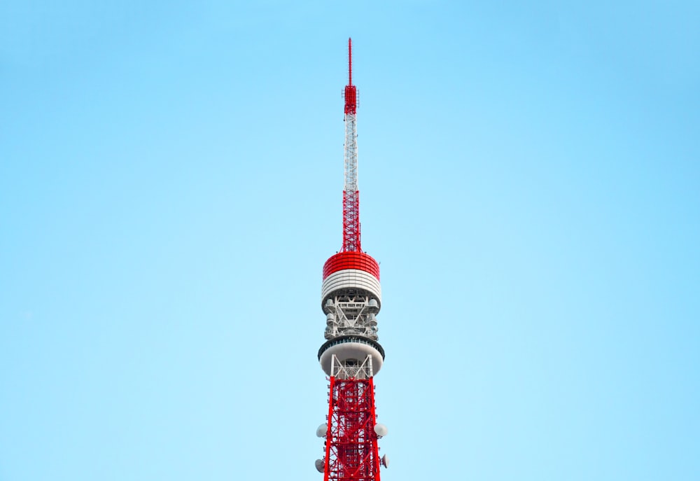 red and white tower under blue sky