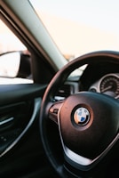 Close-up of a BMW dashboard showing a newly installed Apple CarPlay interface.
