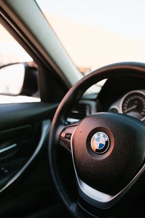 Close-up of a BMW dashboard showing a newly installed Apple CarPlay interface.