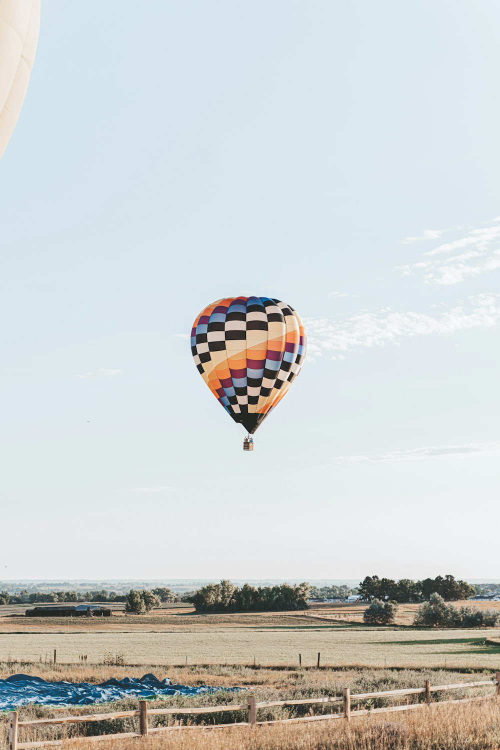 yellow red and blue hot air balloon in mid air during daytime