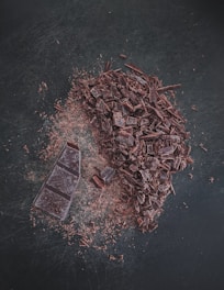 brown dried leaves on black surface