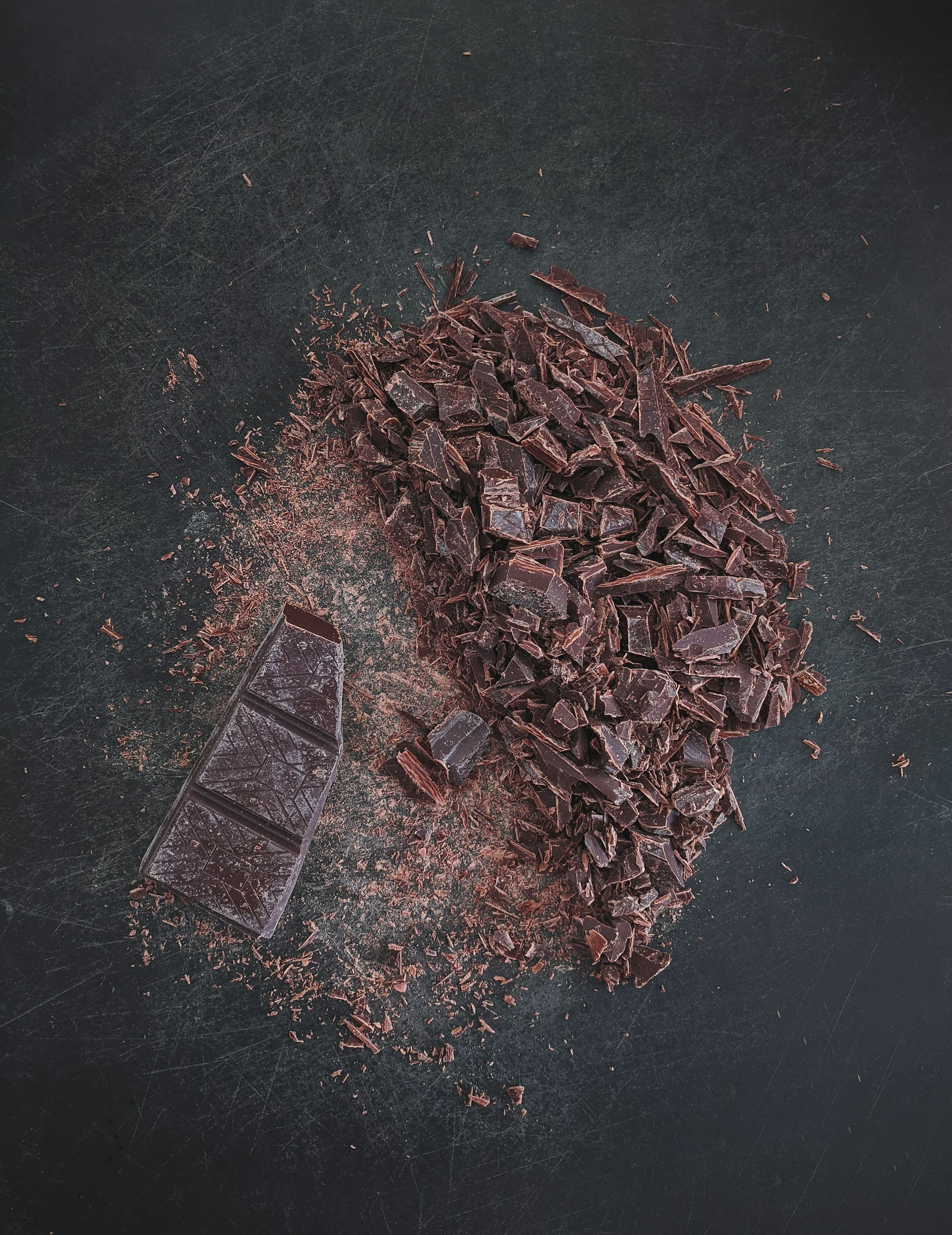 brown dried leaves on black surface