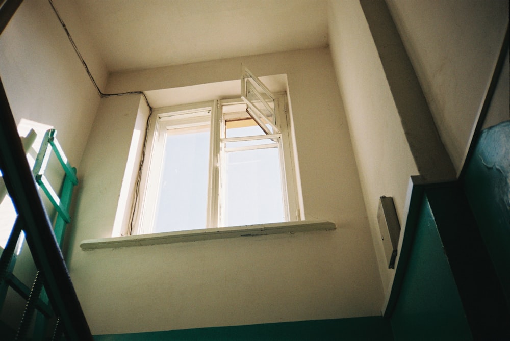 white wooden framed glass window