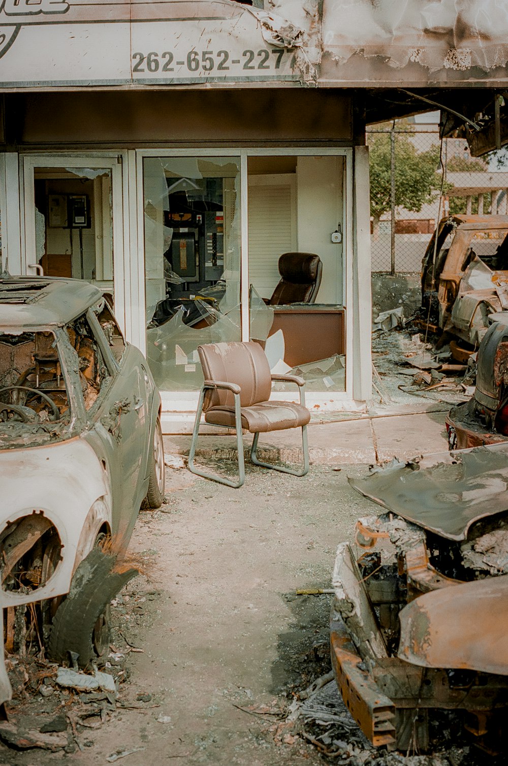 white car near brown armchair