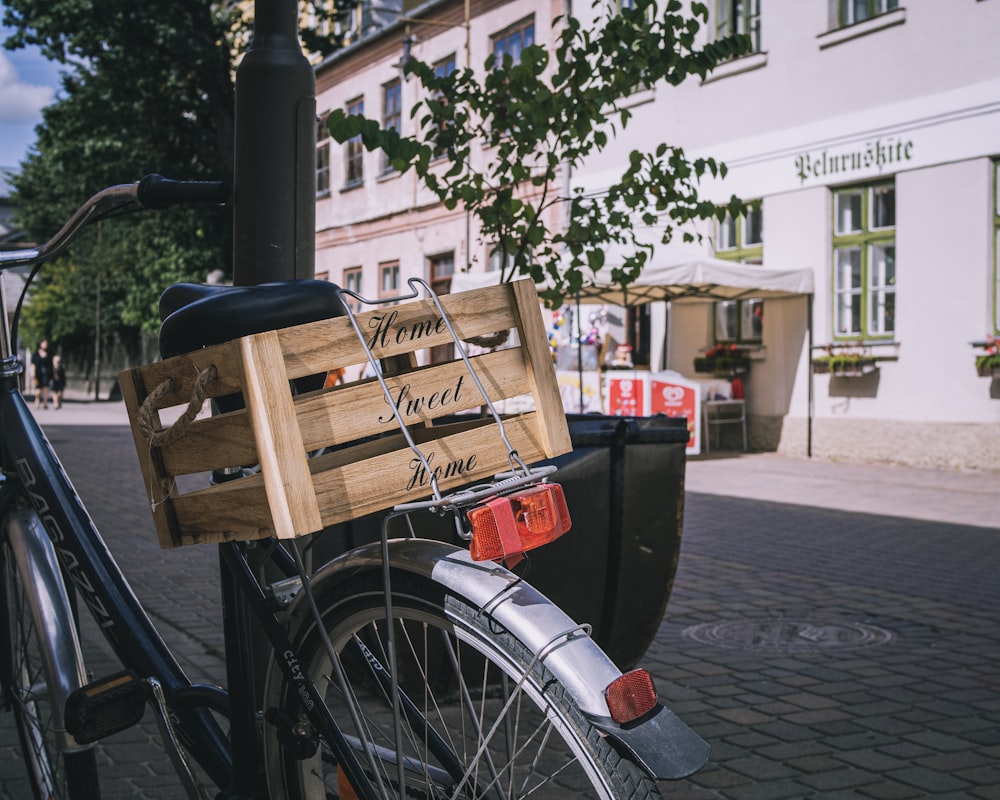 brown wooden crate on black bicycle