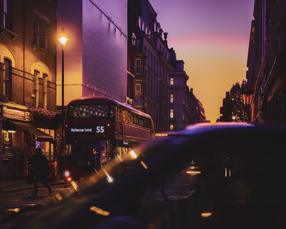 cars on road near buildings during night time