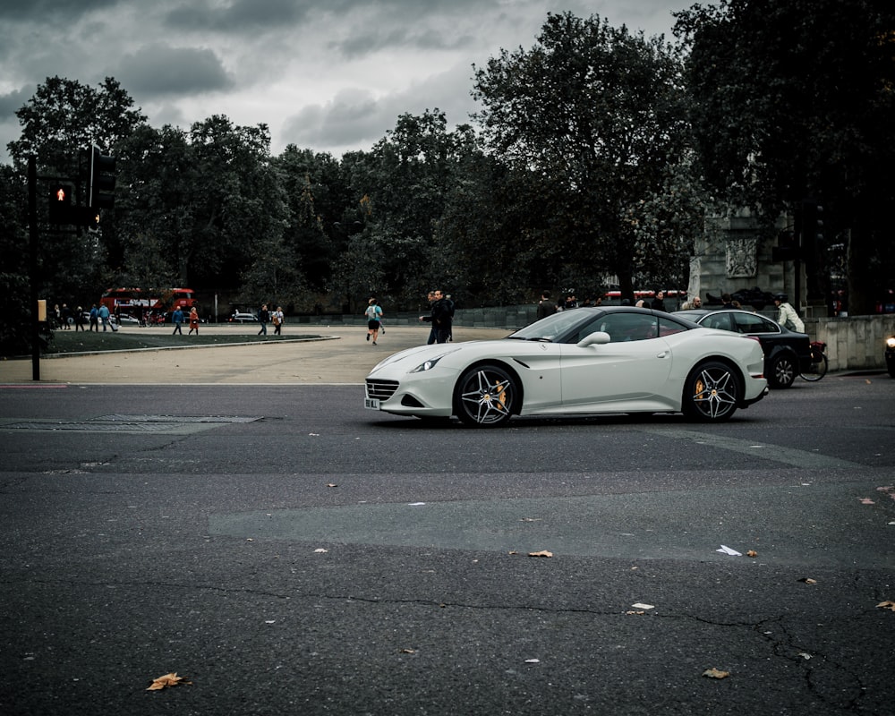 white porsche 911 on road during daytime