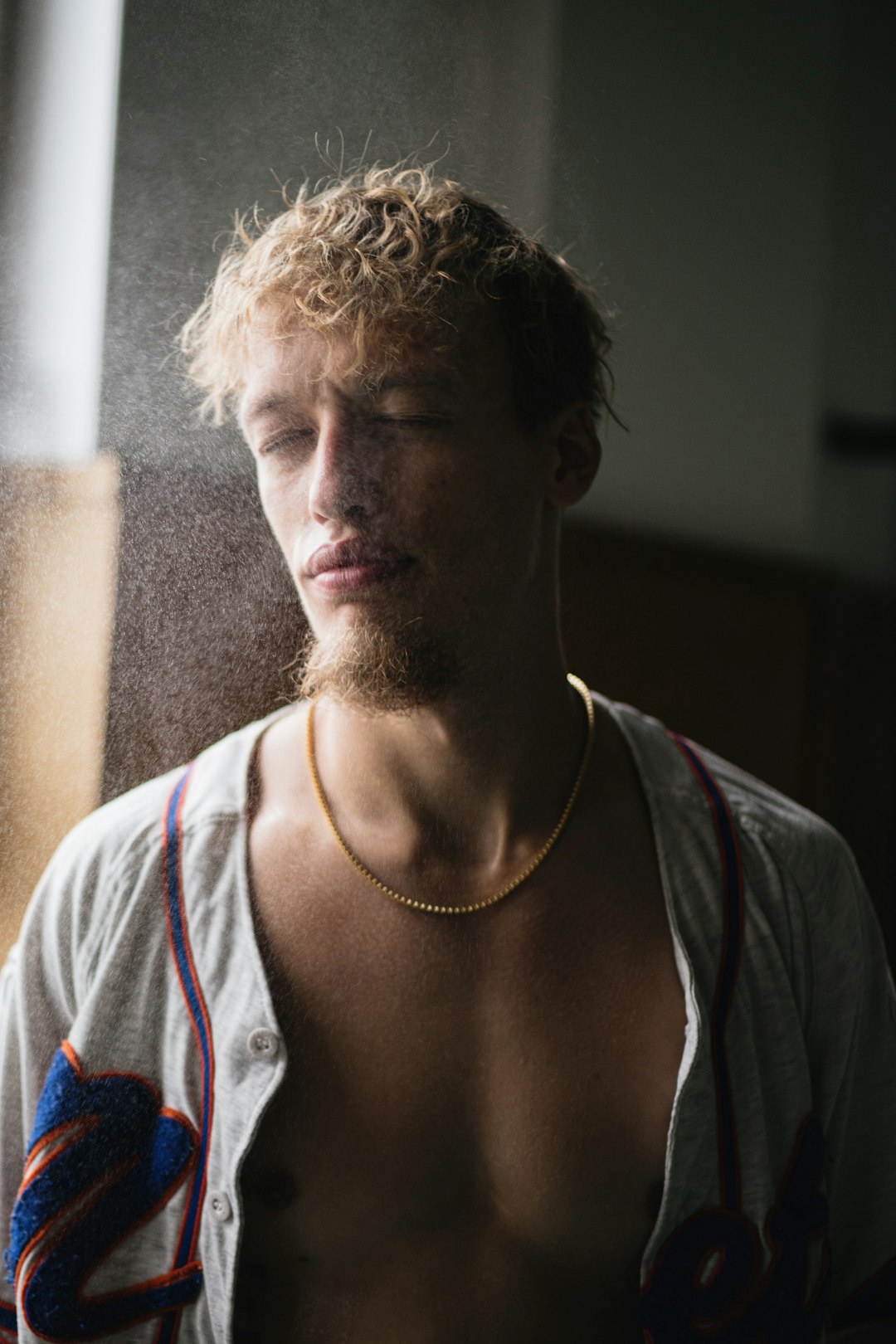 man in white tank top