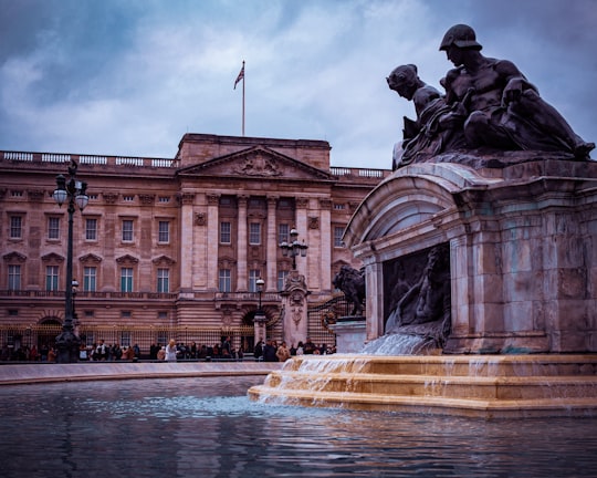 brown concrete building under cloudy sky during daytime in Buckingham Palace United Kingdom