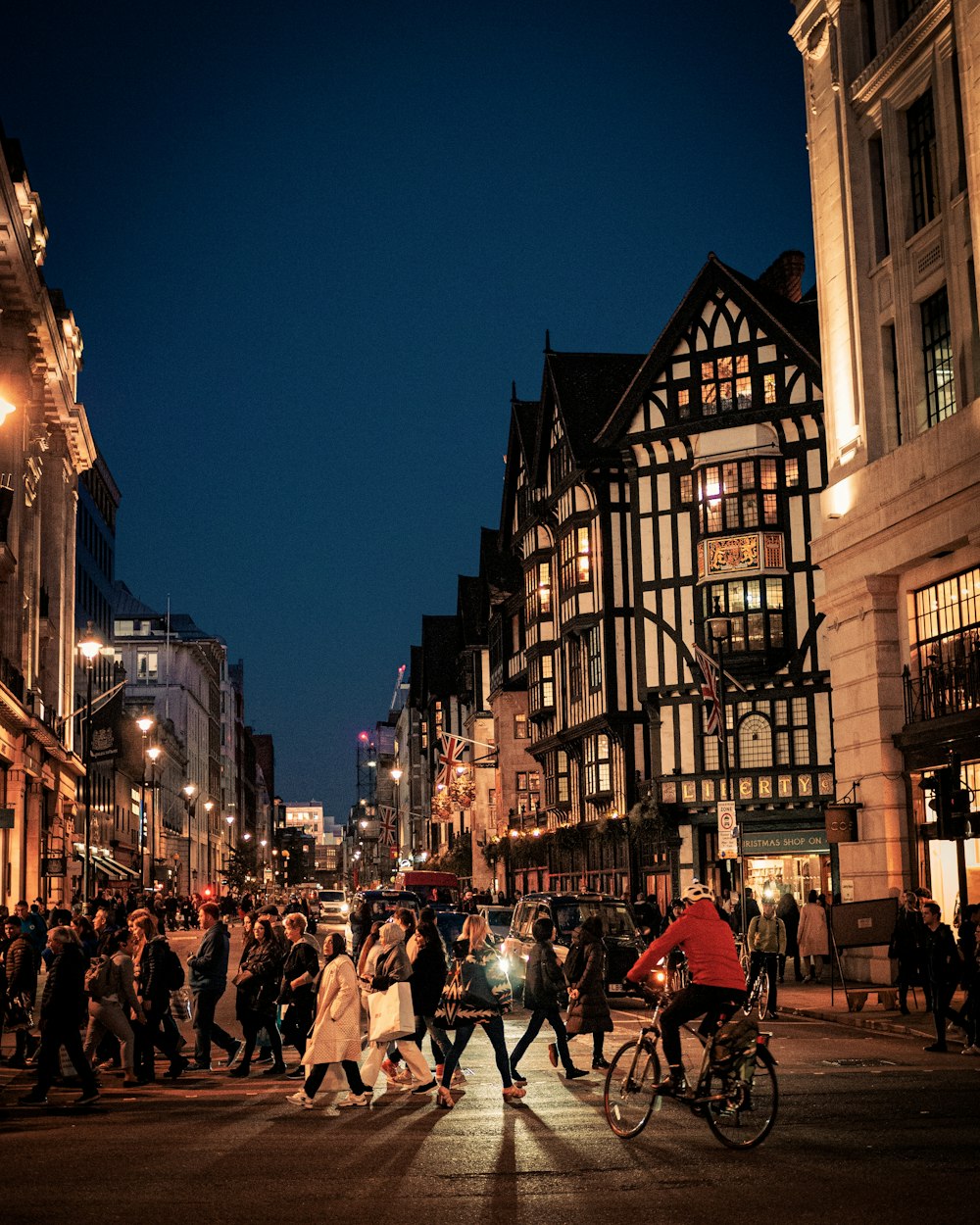 people walking on street during night time