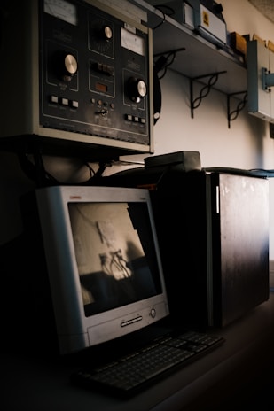 A vintage computer setup with old monitors.