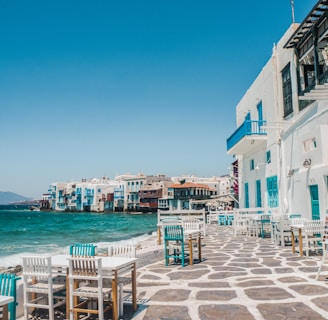 white and brown concrete buildings near sea during daytime