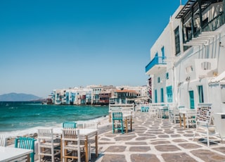 white and brown concrete buildings near sea during daytime