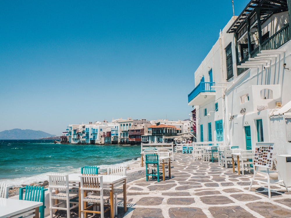 white and brown concrete buildings near sea during daytime