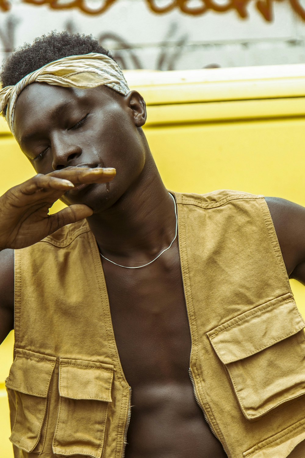 woman in yellow tank top smoking cigarette