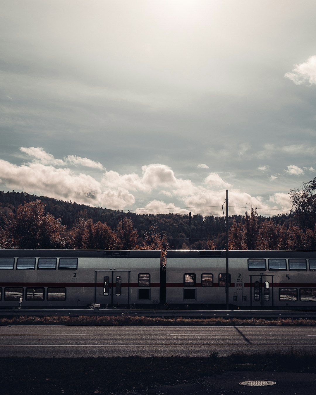 white train on rail road during daytime