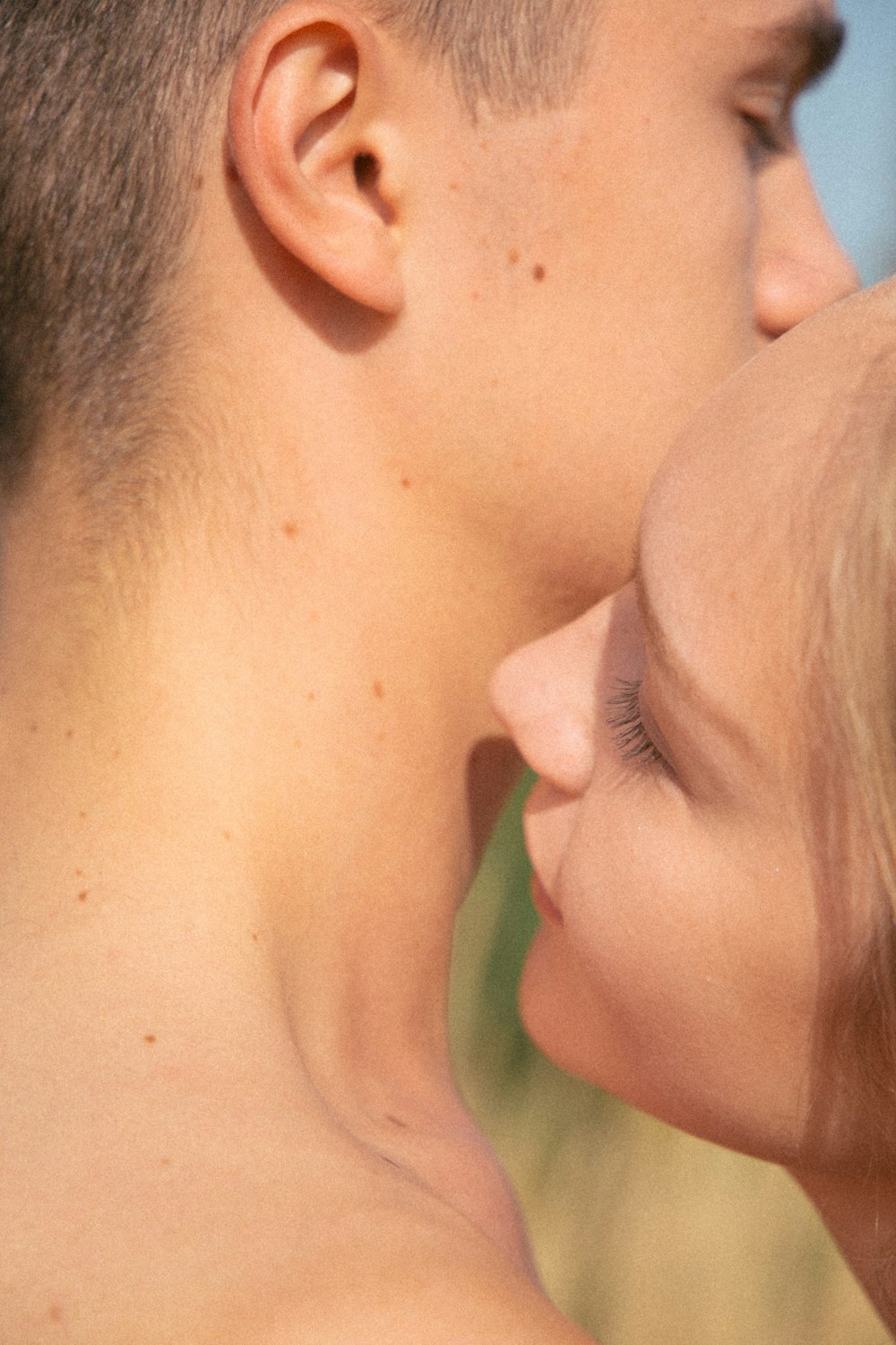 woman kissing mans cheek