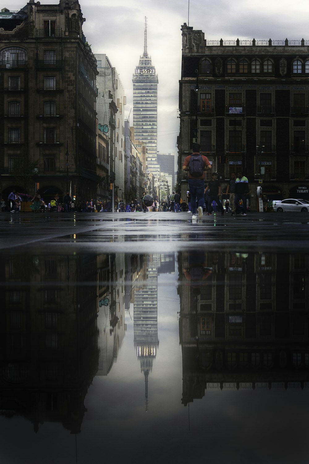 people walking on pedestrian lane during night time