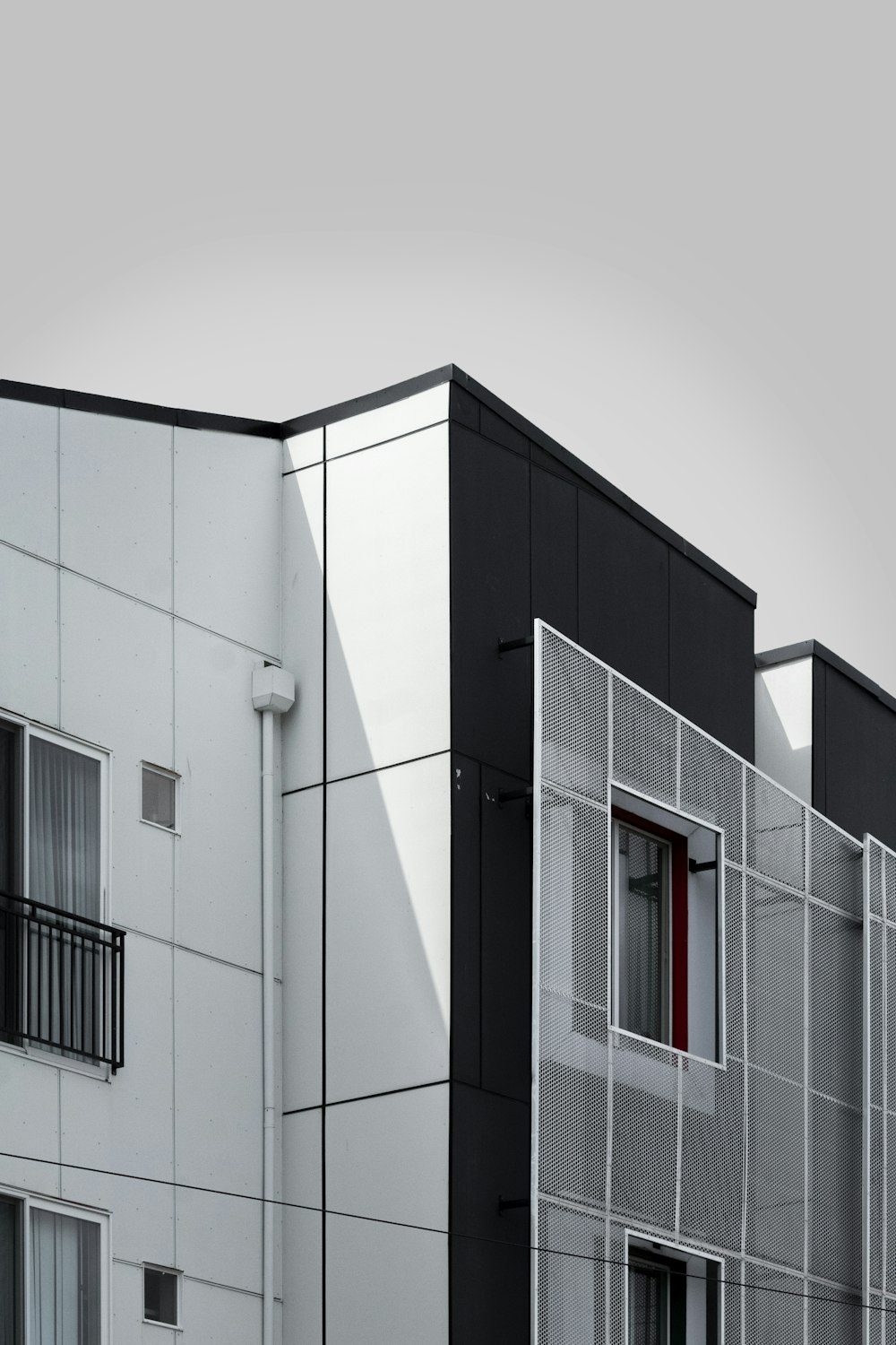 white concrete building under white sky during daytime