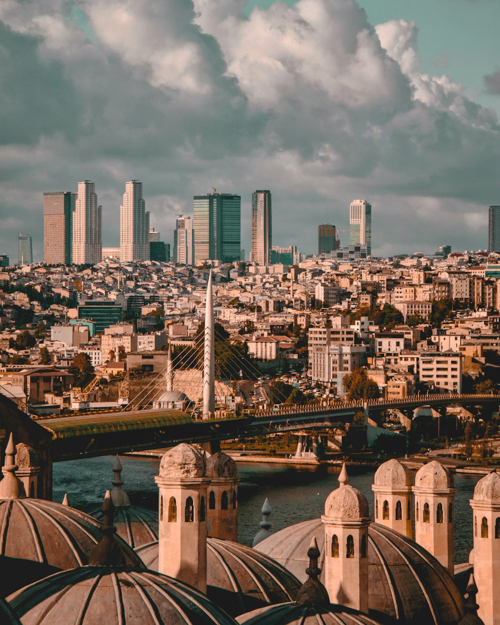 city skyline under white cloudy sky during daytime