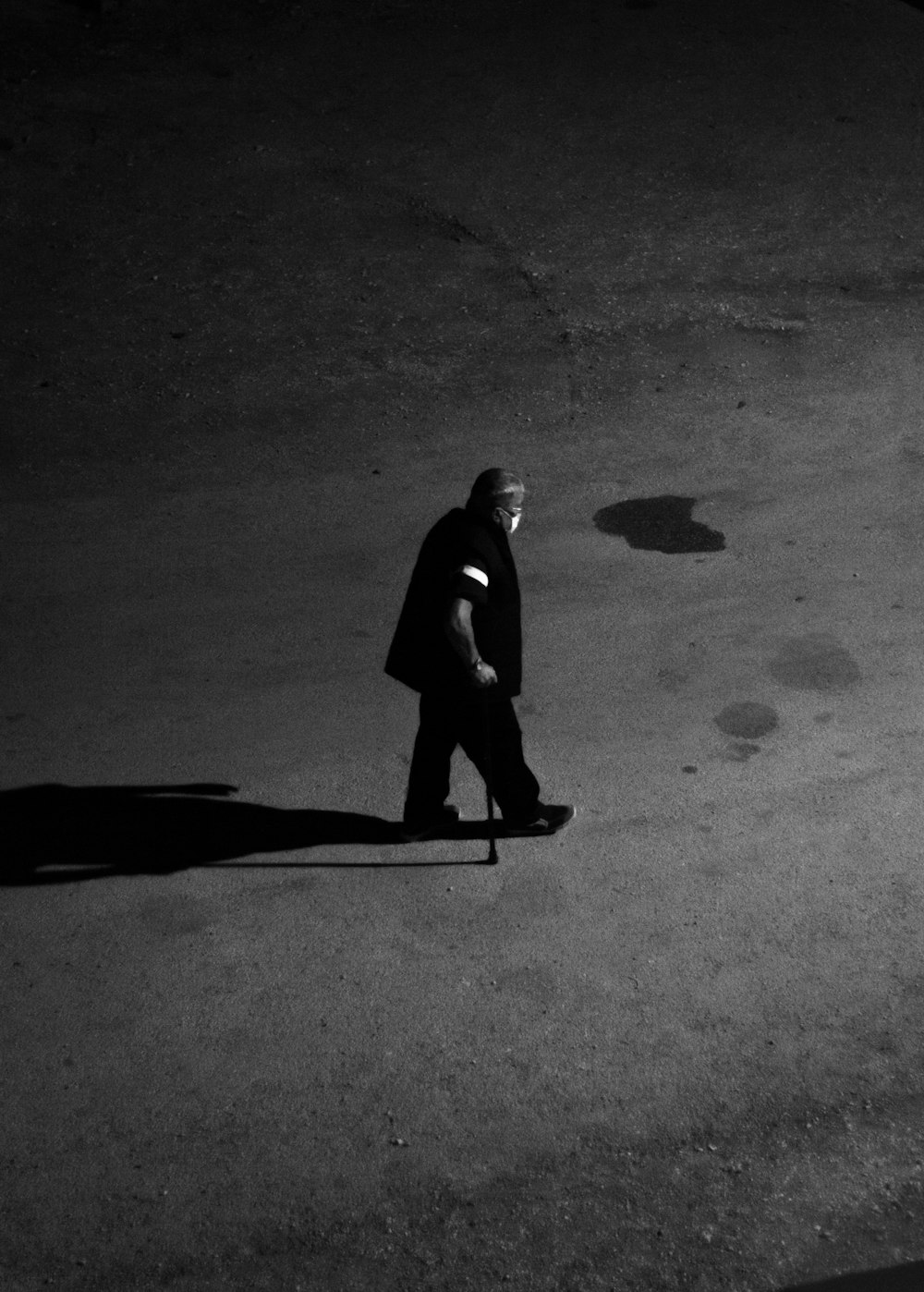 man in black shirt standing on the road