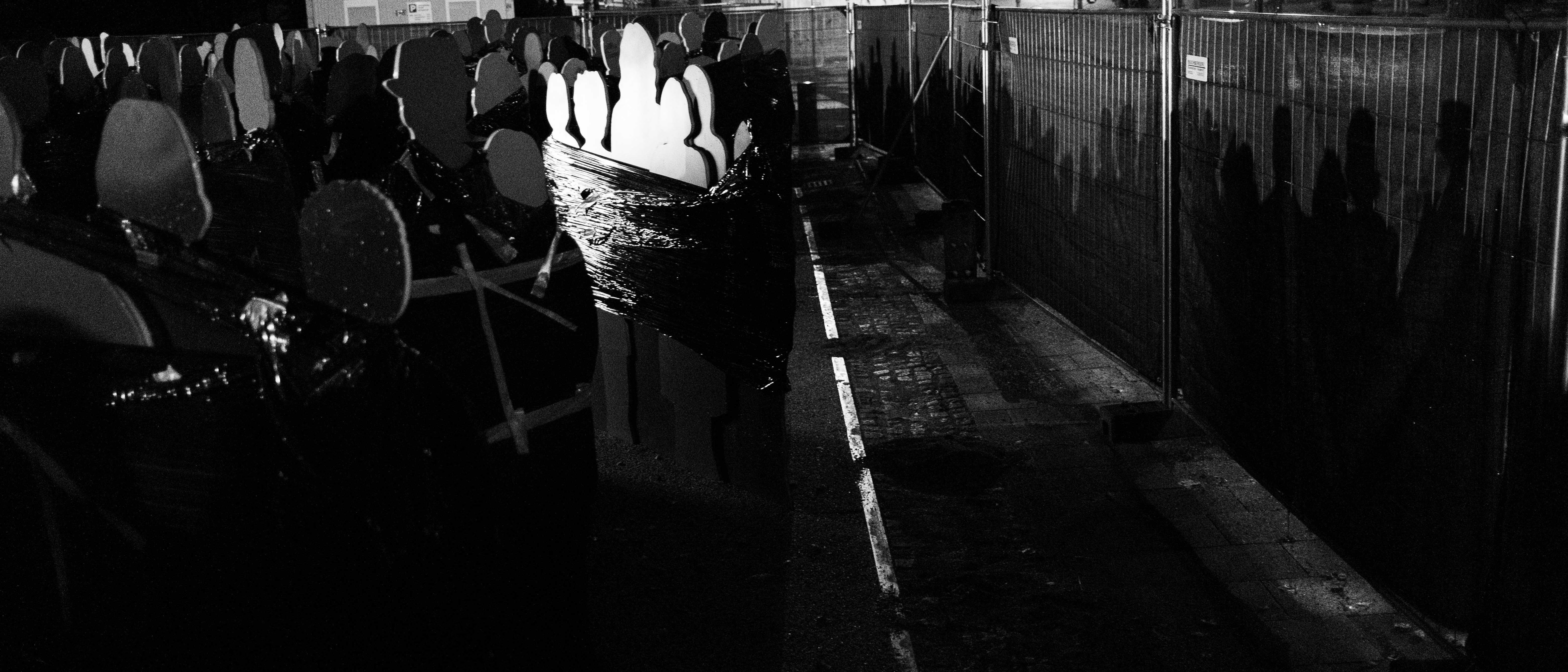 grayscale photo of people walking on sidewalk