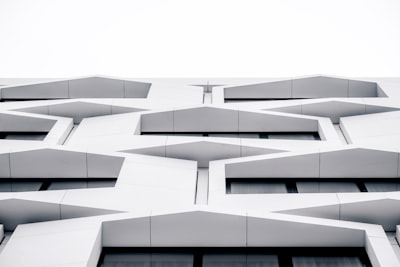 white concrete building during daytime archi-texture teams background