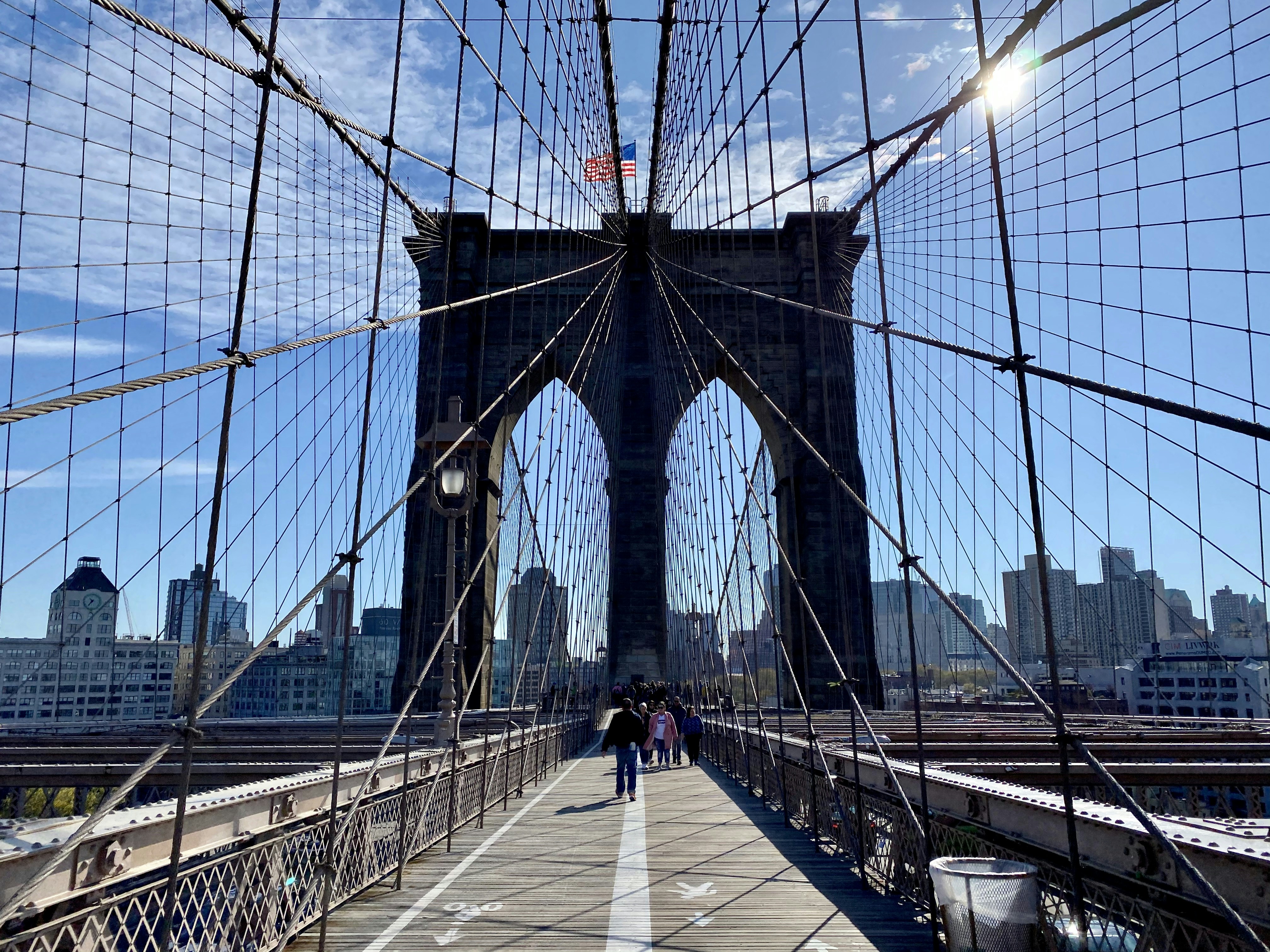 people walking on bridge during daytime