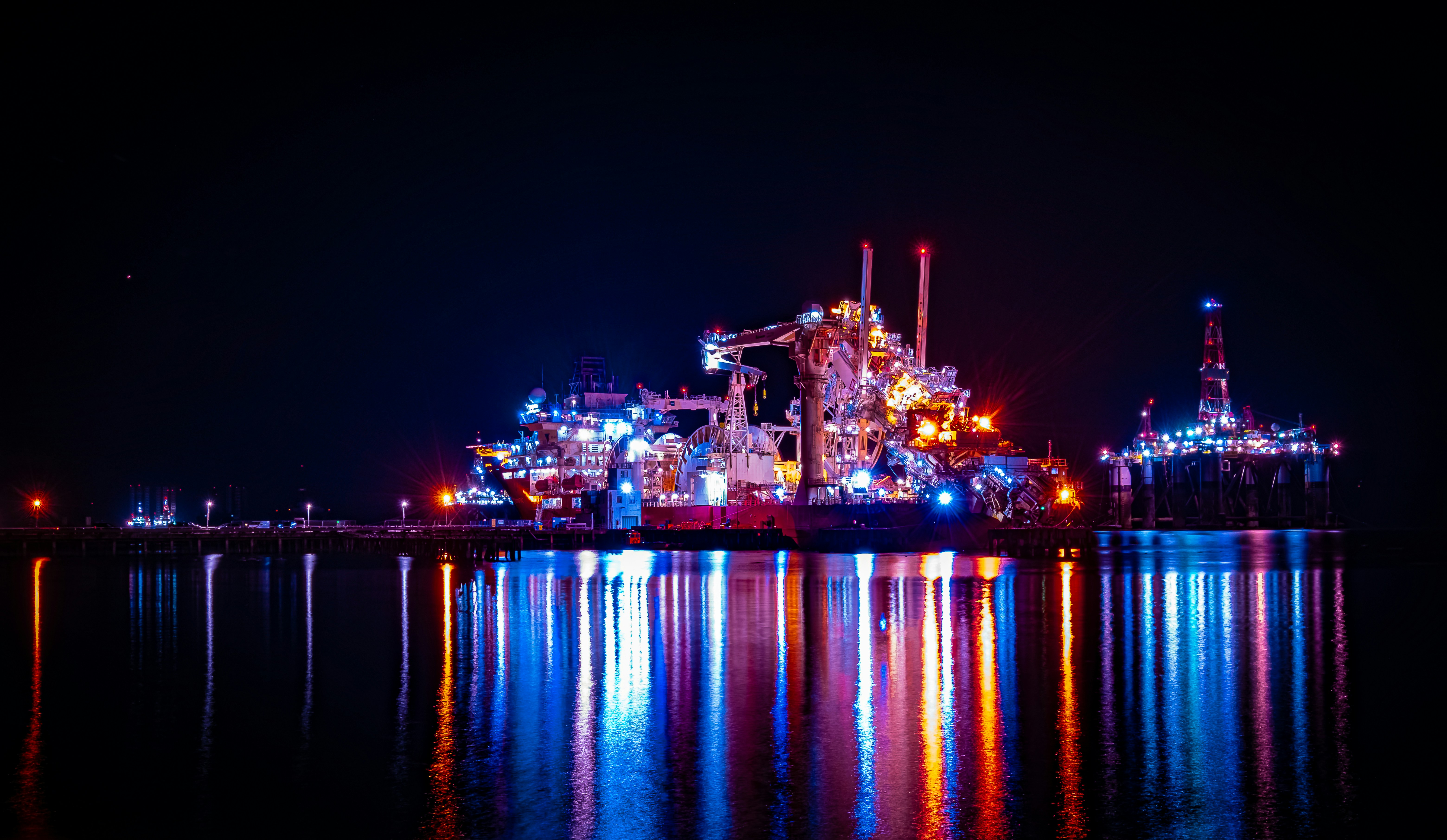 Person working on laptop with creative workspace setup