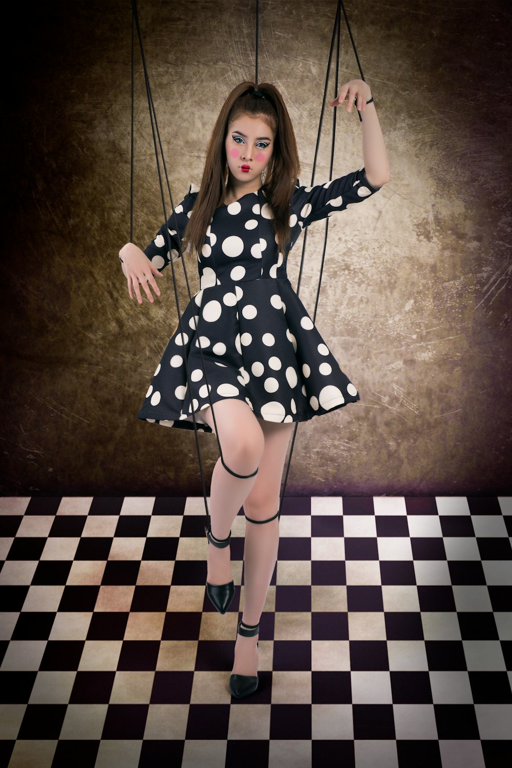 girl in black and white polka dot dress