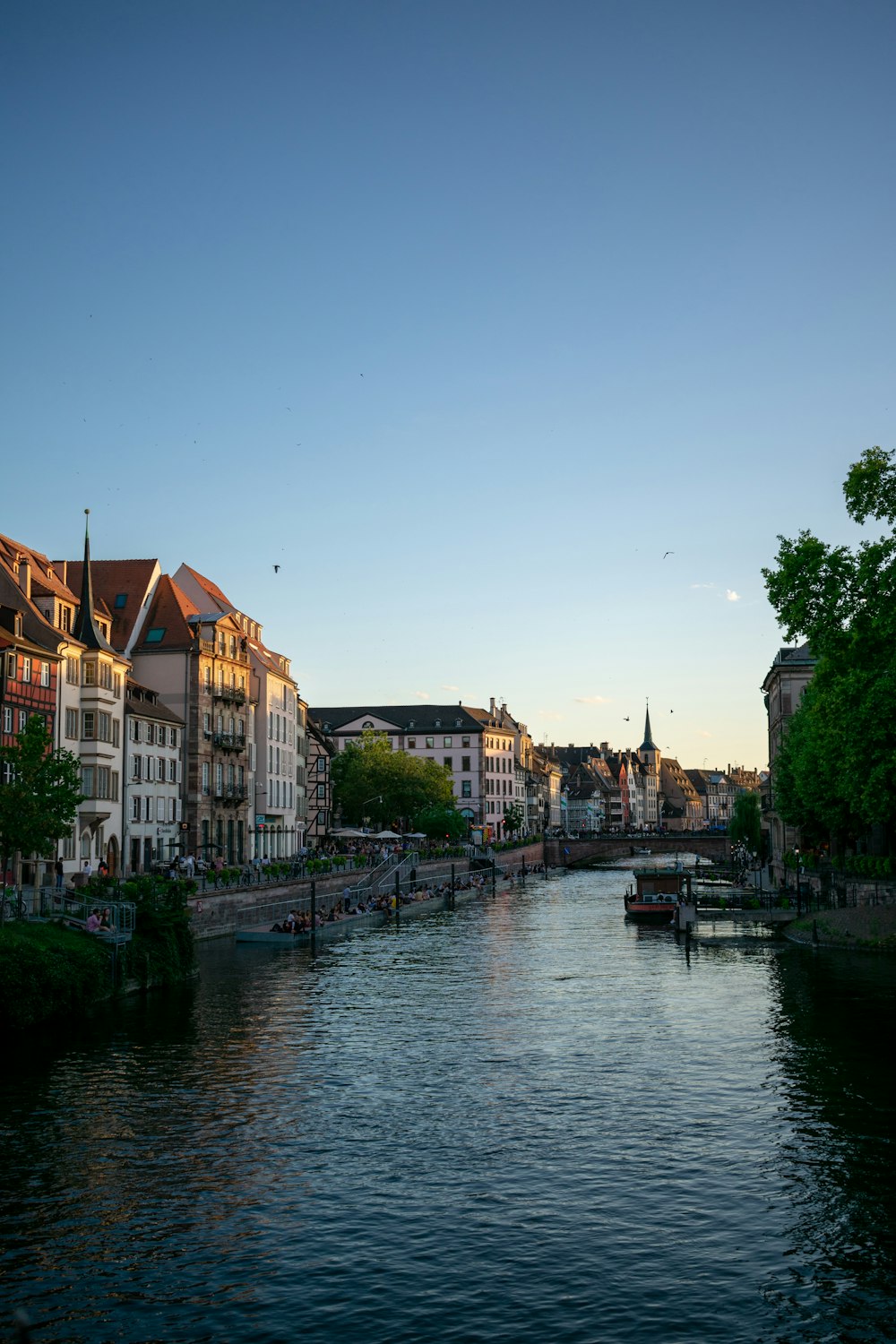 body of water between buildings during daytime