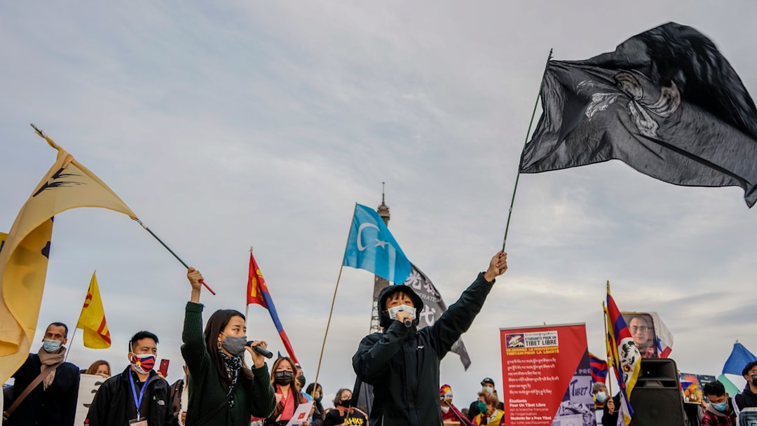 people holding flags during daytime