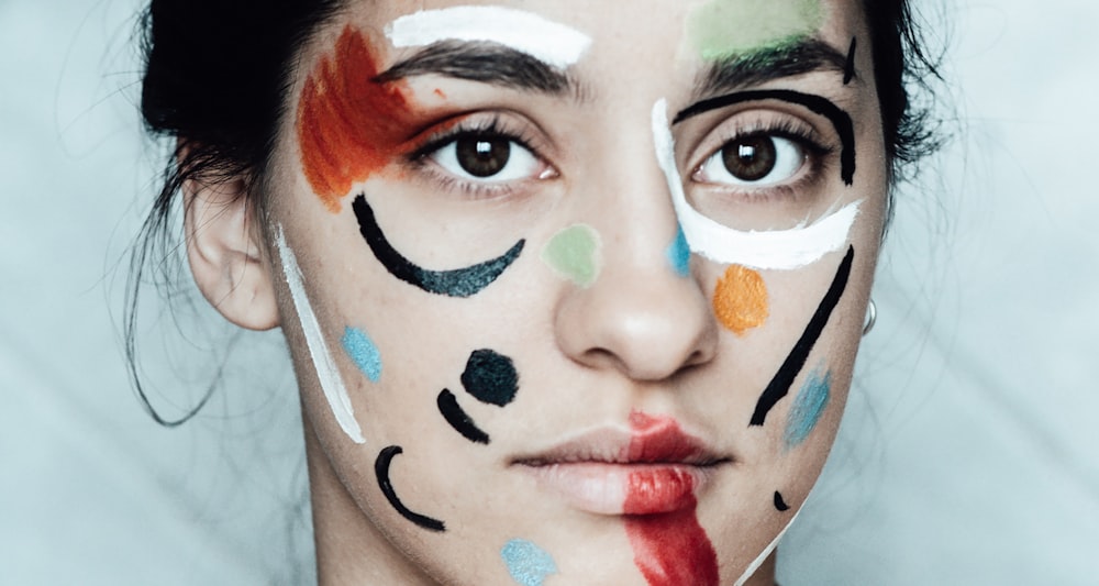 woman with blue and black face paint