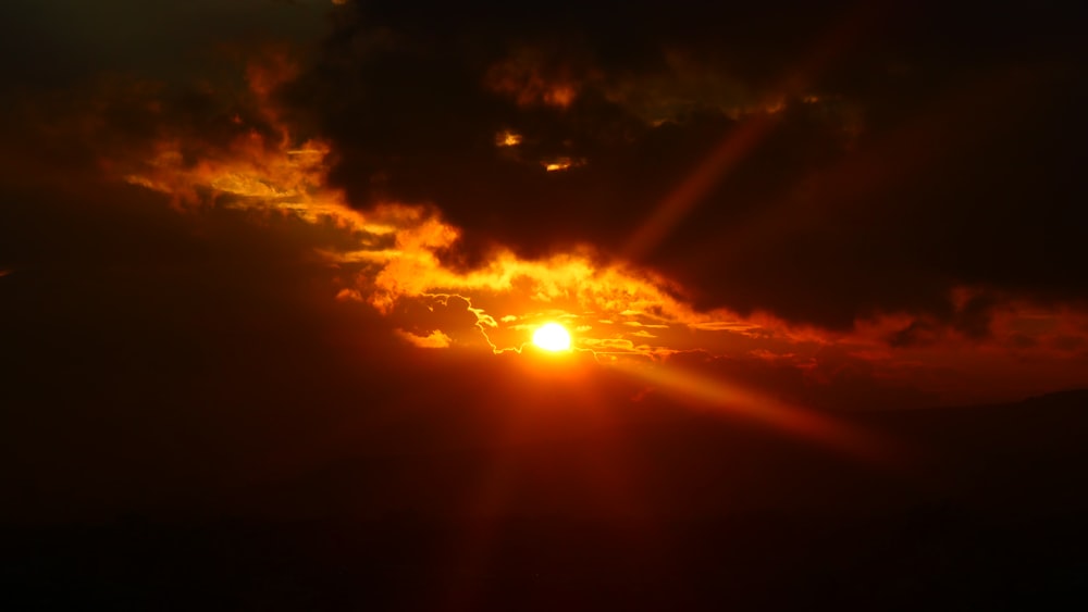 sun covered by clouds during daytime