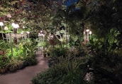 Elegant post lanterns illuminating a garden pathway.