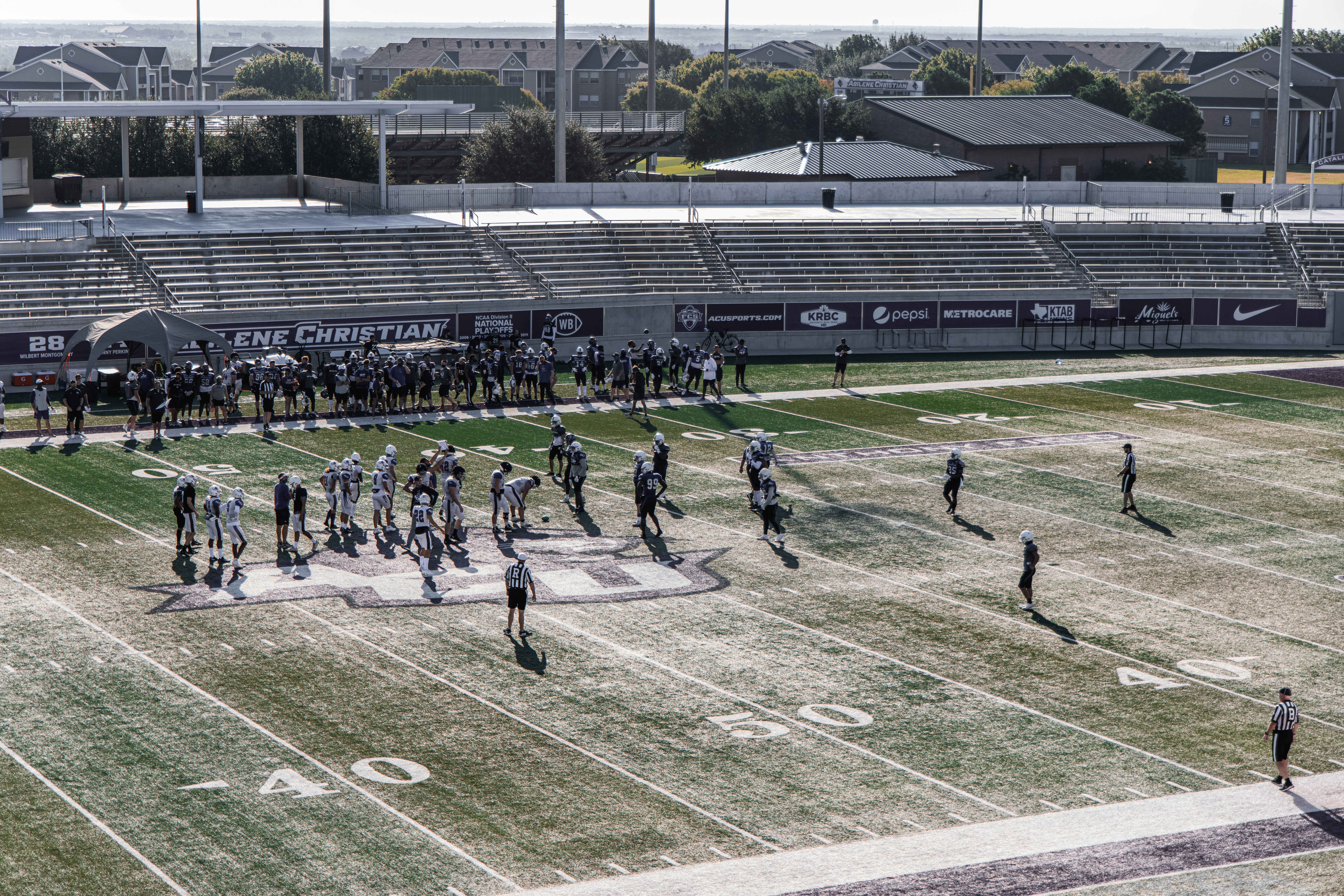 people playing football on green field during daytime photo Free Grey Image on Unsplash