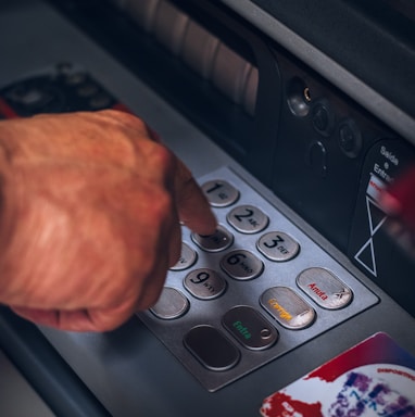 person holding gray and black control panel