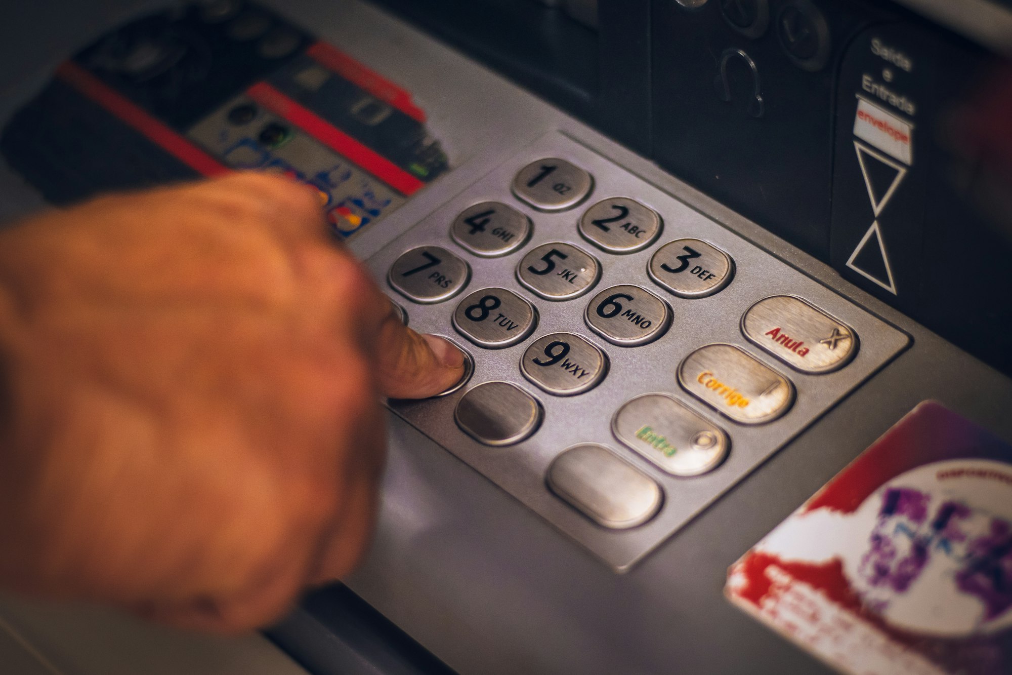 Using a ATM - Hand pressing number