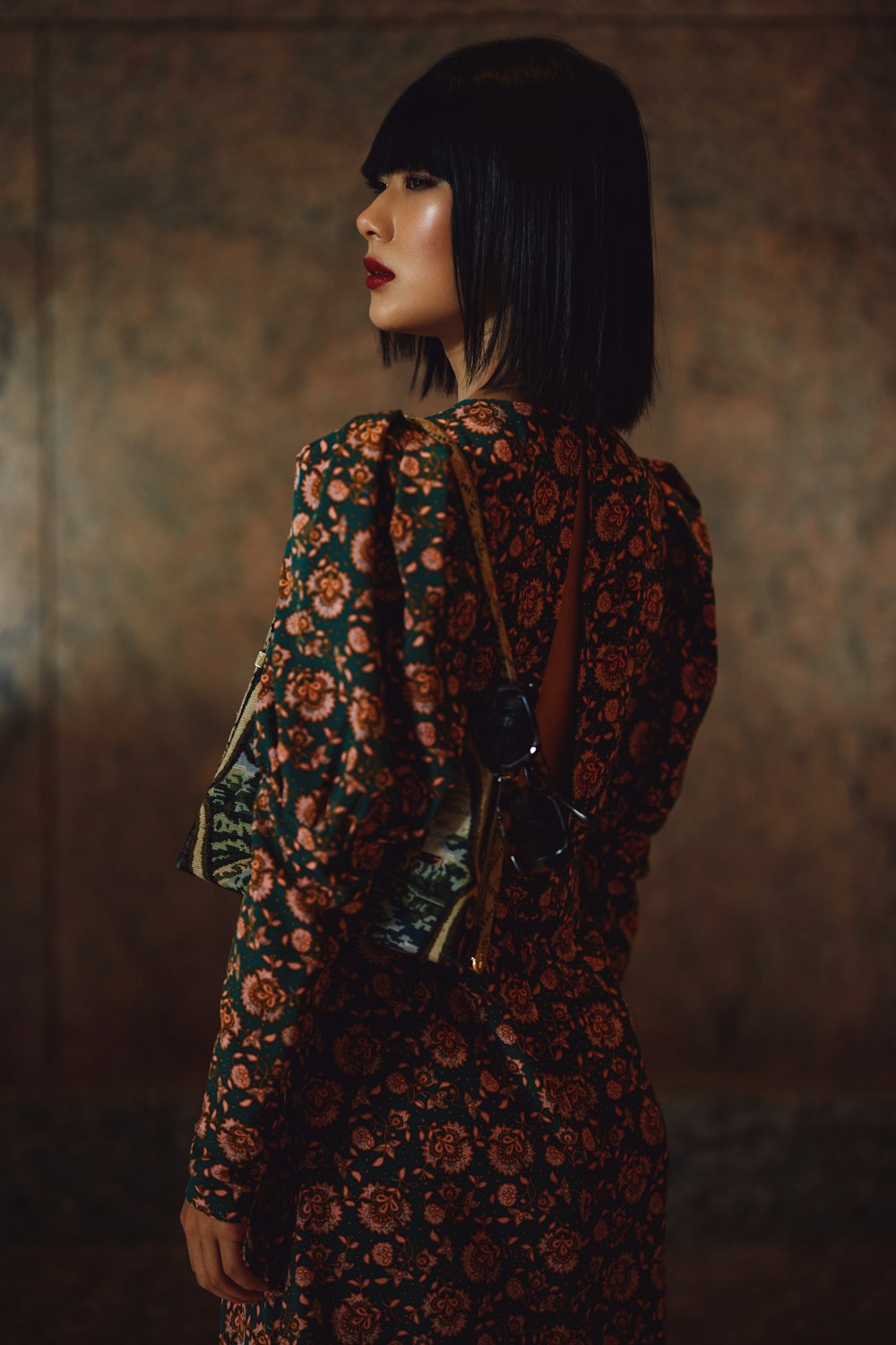 woman in red and black floral long sleeve dress