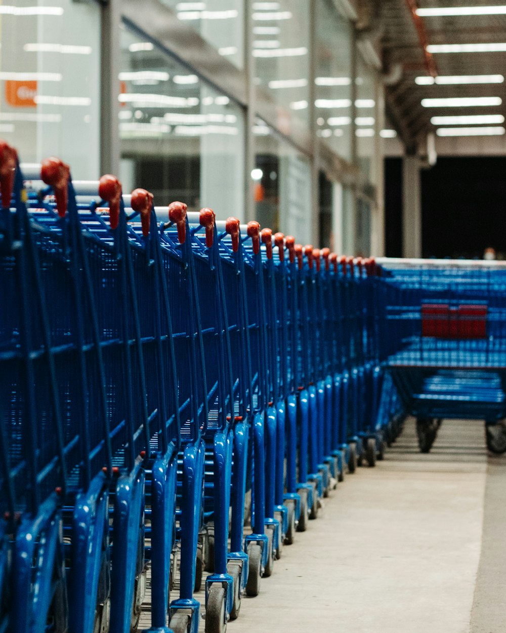 blue plastic chairs on white floor tiles