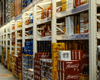 red and white labeled cans on shelf