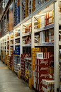 red and white labeled cans on shelf