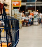 blue shopping cart on street during daytime