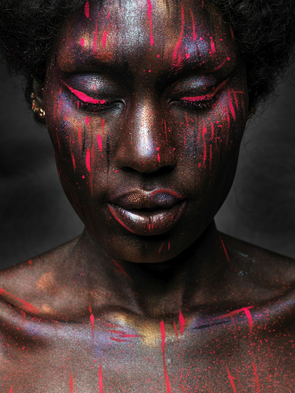 woman with red and black face paint