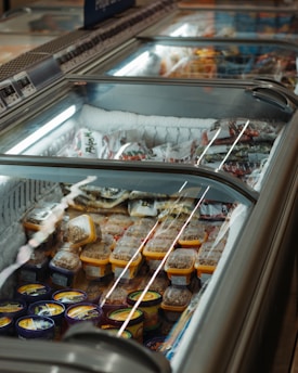 assorted food in silver commercial refrigerator