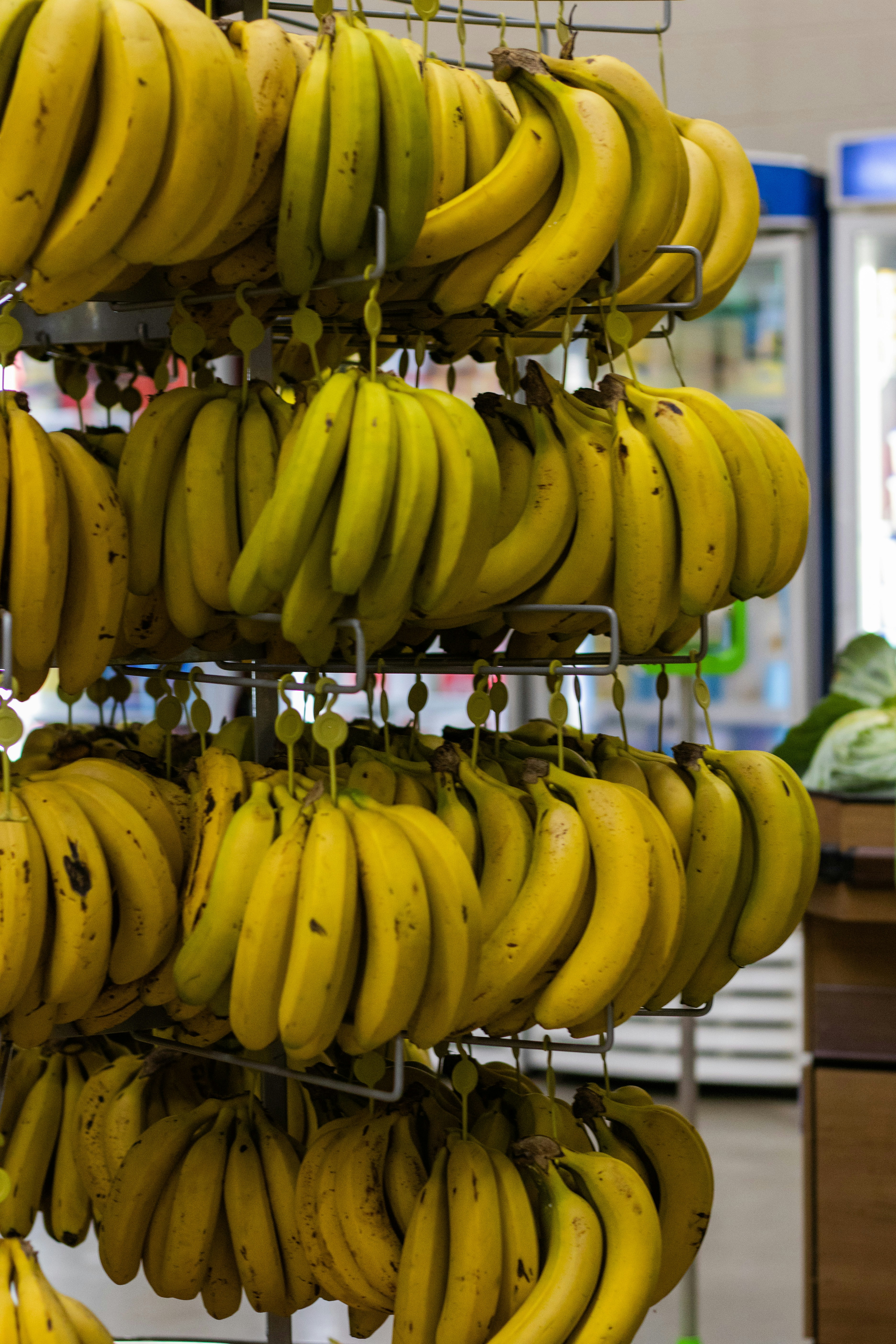 yellow banana fruit on stainless steel rack