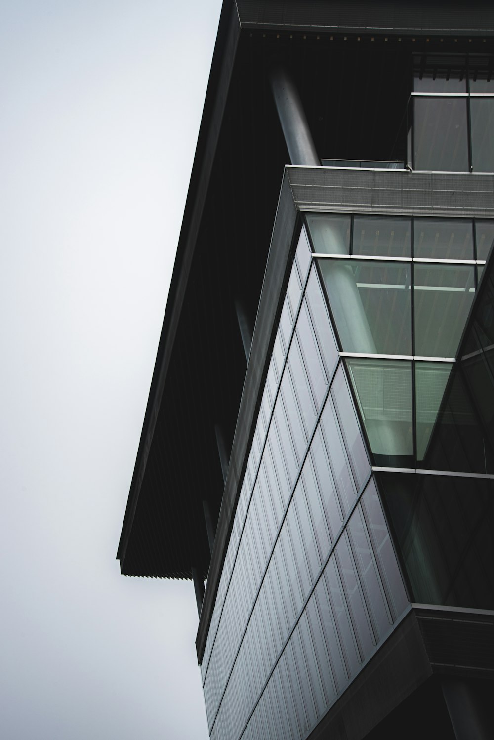 black and gray glass walled building