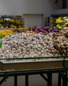 brown and white stones on green plastic crate