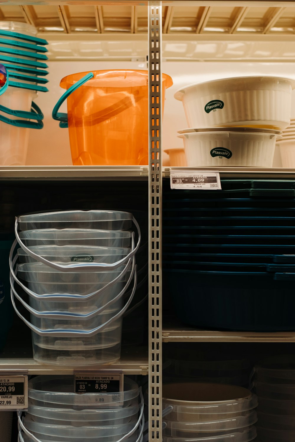 white plastic bucket on shelf